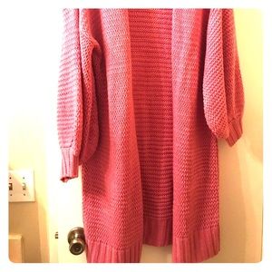 Pink sweater.